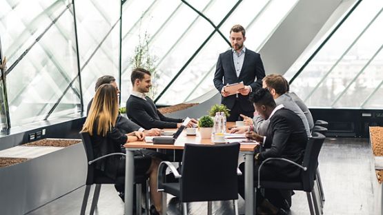 Businessman making a pitch of an idea to his colleagues