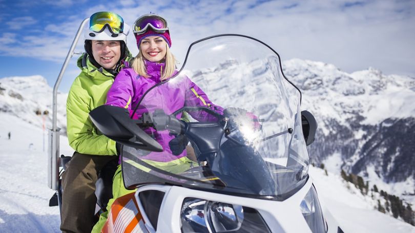 Snowmobile treading through the snow