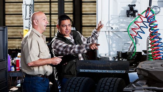 Instructor training a truck driver