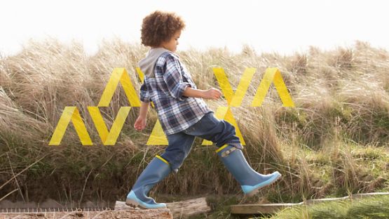 Boy jumping in field