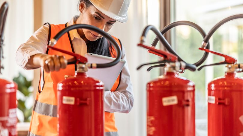 Safety inspector checking the fire extinguishers