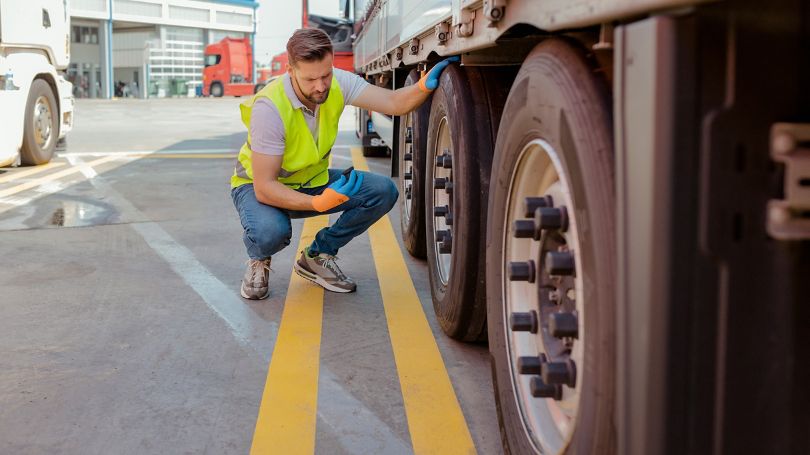 Truck driver checking the truck's safety