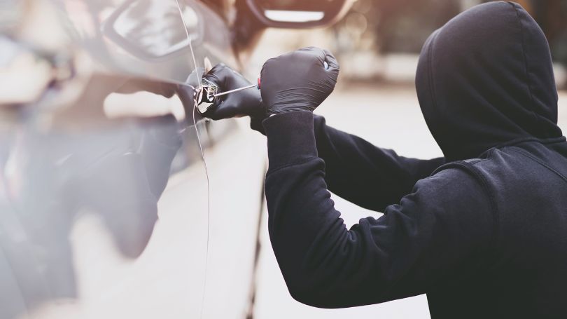  Image of man stealing car