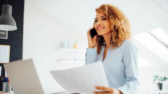 Woman on the phone in an office.