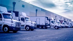 Trucks loading unloading at warehouse