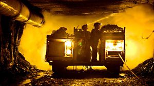 Coal miners in mine shaft