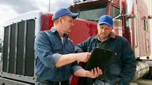 Truck drivers with tablet