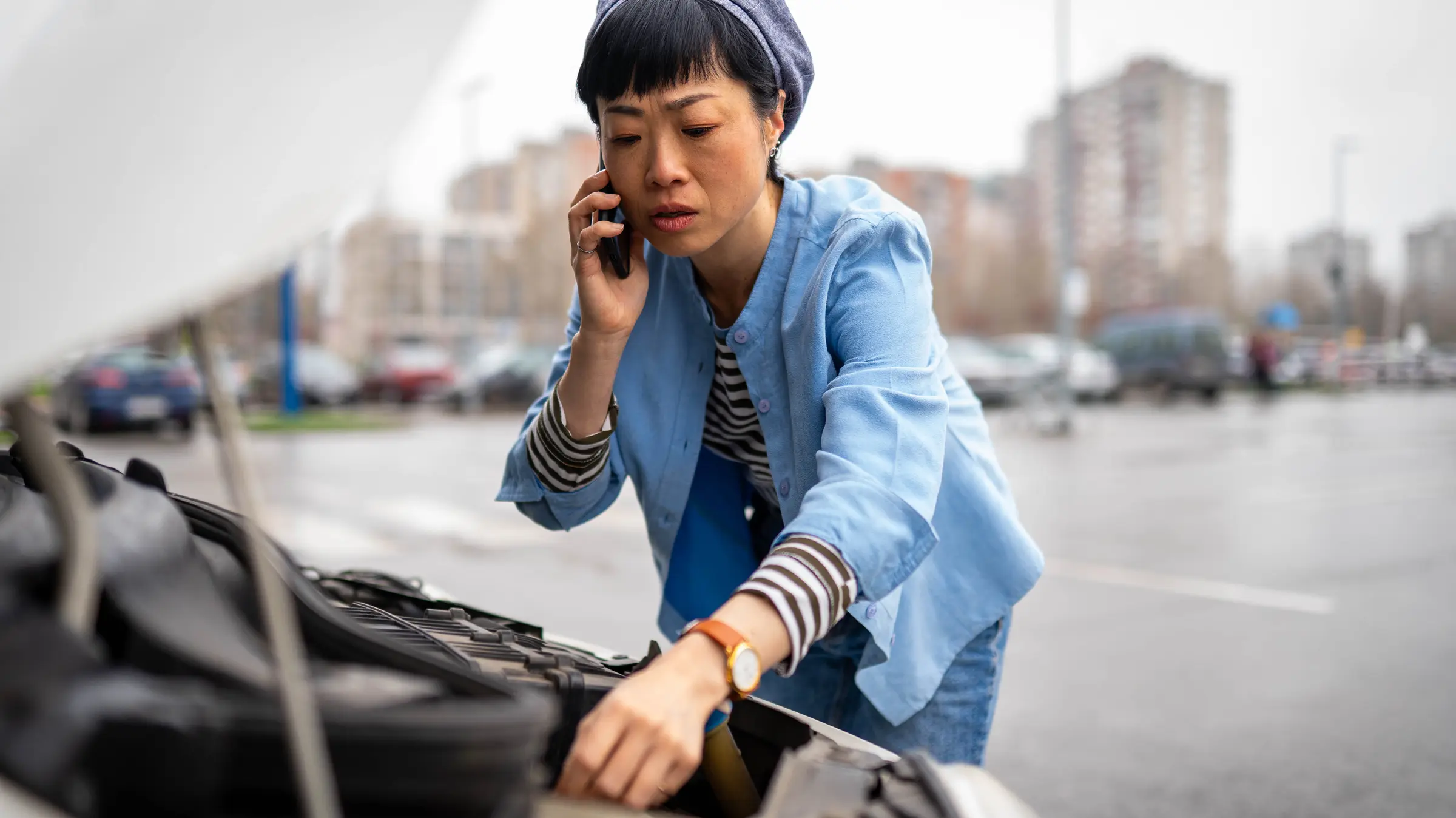 Woman on the phone with car issues