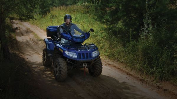 Man on ATV open trail with ATV and snowmobile insurance